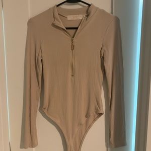 Gorgeous body suit with zipper. Beautiful condition. Size MD